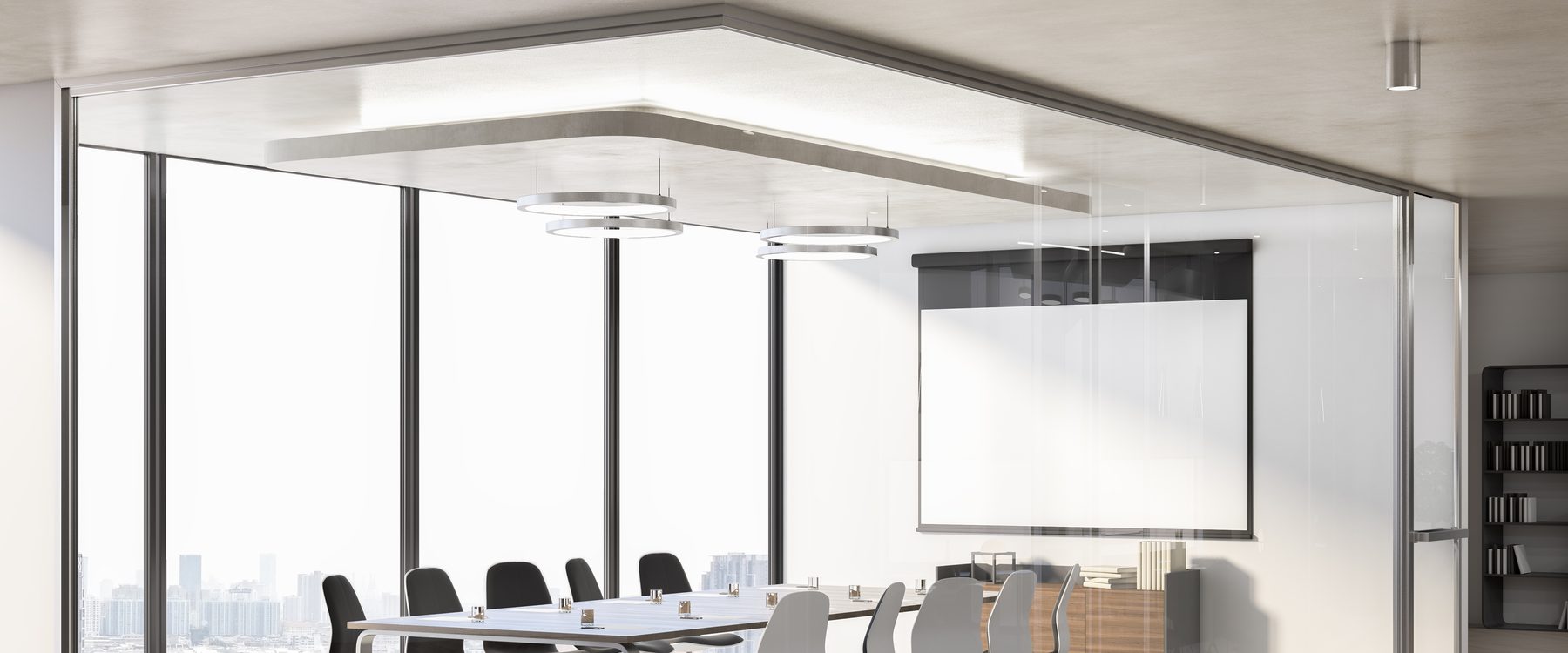 An empty glass-walled meeting room in daylight, chairs at a long table, city visible through
              the windows.